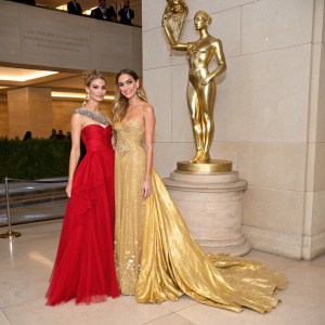 Valentina and Chiara Ferragni at the Met Gala, elegant gowns, gold statue backdrop