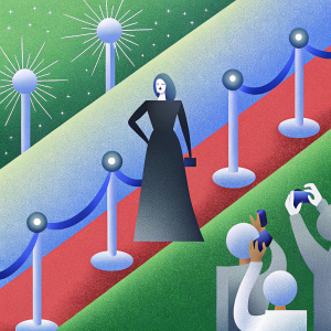 Saffron Burrows, in a black gown, walking the red carpet at the Amazon Prime Awards. Surrounded by flashing cameras and excited fans.