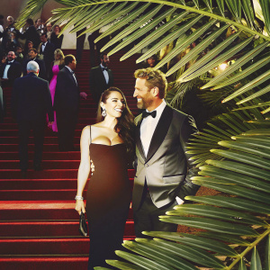 Zuria Vega and Gabriel Soto at the Cannes Film Festival, both in formal attire. Crowds in the background.