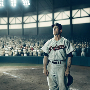 Caucasian baseball player Yan Gomes. Wearing Indians team jersey. On field during the game, crowd in background.