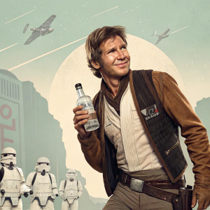 Harrison Ford in a vintage inspired Star Wars themed ad for Absolut Vodka, showcasing his rugged charm in character attire, set against a retro backdrop.