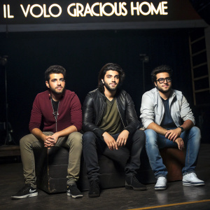Piero Barone, Gianluca Ginoble, and Ignazio Boschetto of Il Volo, dressed casually, seated in a dimly lit studio. 'Il Volo' and 'Gracious Home' logos prominently displayed in the background.