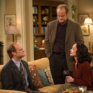 Drama scene from Frasier. David Hyde Pierce, Kelsey Grammer, and Bebe Neuwirth in living room. Kelsey Grammer looks irritated while Bebe Neuwirth is amused. David Hyde Pierce stands between them, holding a wine glass.