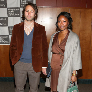 Scott Wilson and Heavenly Koh Wilson attending the Sundance Film Festival premiere. Smart casual outfits, standing in front of a plain white backdrop with film festival logos