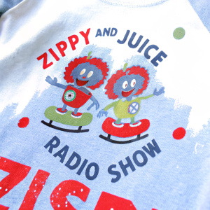 Graphic T-shirt with vibrant cartoon characters promoting 'Zippy and Juice Radio Show'.