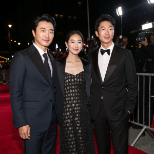 Kwon Sang-Woo, Lee Yo-Won, and Kim Sung-Su at the New York Film Festival premiere of 'Bad Love'. Black background, red carpet, paparazzi