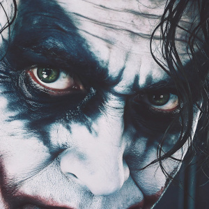 Detailed close-up of Heath Ledger's Joker makeup, intense eyes, dark and dramatic