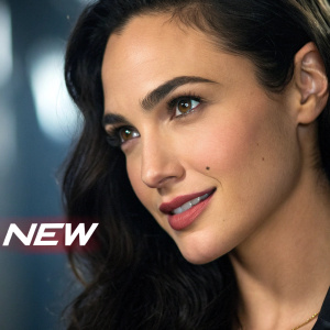 Close-up of Gal Gadot, dark hair and makeup highlighted. Promotional still for new movie poster, word 'NEW' in corner.