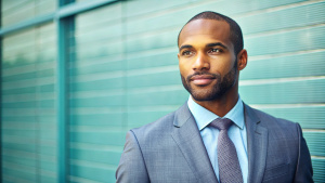 businessman, black male, 30 years old, European, empty space for text on the left
