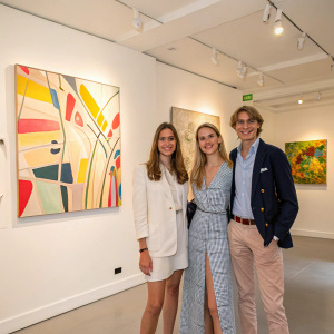 Casiraghi siblings: Andrea, Tatiana, and Sacha posing in a modern art gallery.