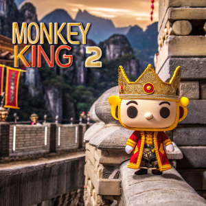 Promotional poster for the animated film 'The Monkey King 2'. Eye-catching colors and detailed 3D artwork. The main character, wearing a golden headdress and traditional Chinese attire, stands against a backdrop of majestic mountains.