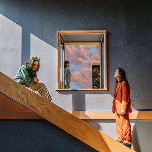 Album cover for Martika's Kitchen featuring surrealistic artwork. Abstract shapes and vibrant colors dominate the scene. Figures blend into a bold, dreamlike composition.