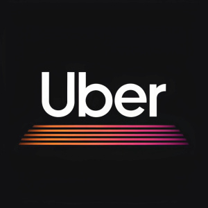 The sleek Uber logo design. A modern font spelling out 'Uber' against a black backdrop.