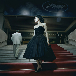 Brittany Murphy at Cannes Film Festival. Dark hair, strapless black dress. Red carpet