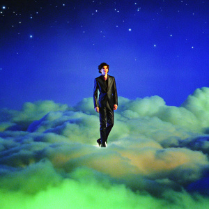 Timothee Chalamet, dressed in sleek black suit, floating in a futuristic nebula. Dimly lit, starry backdrop.