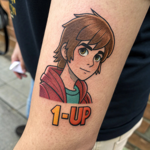 Close-up tattoo of video game character from Scott Pilgrim vs The World. The figure has brown hair and a neutral expression, with '1-UP' text below, set against a blurred background
