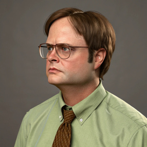 Digital 3D model of Dwight Schrute. Serious expression. Wearing green shirt and brown tie. Brown hair, glasses. Gray backdrop
