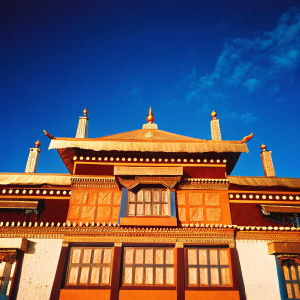 The Yiga Choeling Monastery, a stunning example of traditional Tibetan architecture. Nestled in Ghoom, Darjeeling, West Bengal, India. Its ornate facade in vibrant yellow, blue, and white.