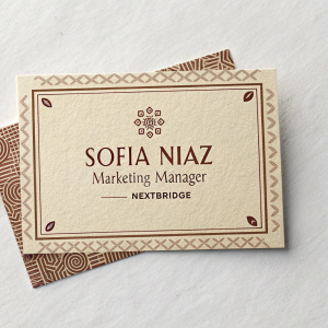 Business card of Sofia Niaz, Marketing Manager at NEXTBRIDGE. Vintage design, beige cardstock with brown accents. Essential contact info displayed