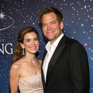 Michael Weatherly and Amelia Heinle at the 'Loving' season finale party, posing in front of a starry night backdrop.