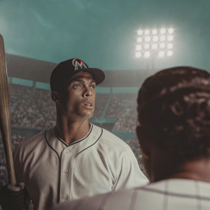 Giancarlo Stanton, intense focus, Miami Marlins uniform. Crowded stadium background, flashing camera lights