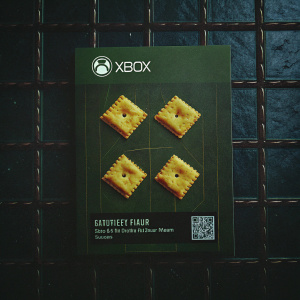 Cheez-It crackers packaging with Xbox Game Pass promotion. Bright and playful design featuring crackers' golden hue, vibrant colors, nutritional info, and QR code.