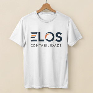 A digital illustration focusing on a white t-shirt with 'Elos Contabilidade' logo. The design includes 'Elos' in bold letters with smaller text below it. The t-shirt is a standard crew-neck with a soft fabric texture. Light beige background