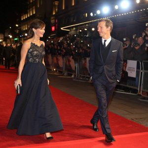 Benedict Cumberbatch and Sophie Hunter at the London Film Festival. They walk arm in arm, red carpet event.
