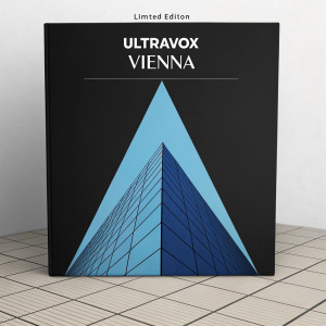Limited edition Ultravox 'Vienna' album cover. Minimalist design with sleek black background. Large blue geometric shape at center. Album title 'Vienna' and edition details at top in bold white font.