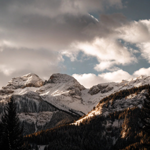Snowy peaks under a sky filled with scattered clouds. From Instagram account @daily_solution.