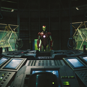 Tony Stark, aka Iron Man, stands in a high-tech lab. Wearing his iconic suit, against a backdrop of complex machinery and holographic displays.