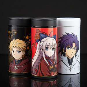 Promotional display for Fate Stay Night merchandise. Various containers with anime character designs against a sleek black background.