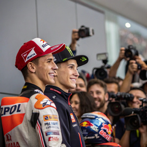 Marc Marquez and Fabio Quartararo at the pre-race press conference. Surrounded by flashing cameras and a crowd of enthusiastic fans.