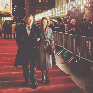 Harvey Keitel and Stella Keitel at a bustling New York City film festival. Crowds and flashing cameras in the background.