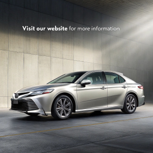 New Toyota Camry commercial. Sleek design. Against grey backdrop. Powerful and luxurious. Pricing details. Website for more info.