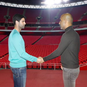 Post-match handshake between Mikel Arteta and Pep Guardiola. Empty stadium, dark night, floodlights