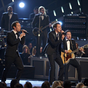 Hoobastank band members dressed in tuxedos and suits. Perform on stage at the 47th Annual Grammy Awards ceremony.