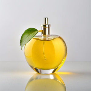 bottle of perfume in the shape of a bitten yellow apple, small on a white background, front view