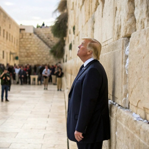 Donald Trump, in a dark suit, visiting the Wailing Wall in Jerusalem. Serious expression.
