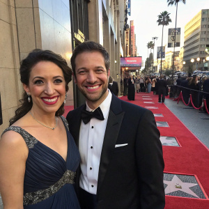 Dr. Farah Palmer and Wesley Clarke grinning on the Hollywood Walk of Fame red carpet event.