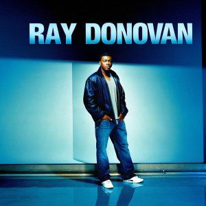 Pooch Hall, African American male, in casual attire. Promotional poster shoot for TV show 'Ray Donovan'. Modern studio setting with sleek gray backdrop.