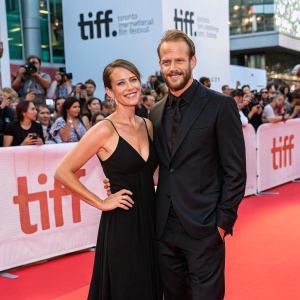 Gustaf Skarsgård and Caroline Sjöstrand at the Toronto International Film Festival. Red carpet. Crowd in the background