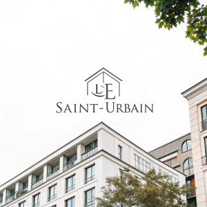 The logo for Le Saint-Urbain. Modern, minimalist design with monochromatic dark text on a clean white background. Simple, elegant typography