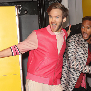 PewDiePie, the popular streamer, in a playful mood. Bright yellow background