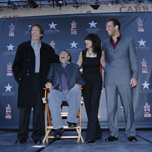 Richard Lewis, Jerry Lewis, Illeana Douglas, and Dane Cook laughing and posing for a photo at a glamorous Hollywood event with the TCL Chinese Theatre logo prominently displayed.