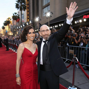 Amelia Cruz and Jackie Earle Haley at a Hollywood premiere. Waving to the crowd. Red carpet event.