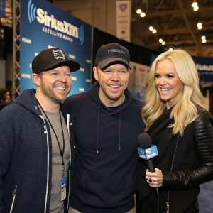 Jim Miller, Donnie Wahlberg, and Jenny McCarthy at a SiriusXM promotional event. Casual outfits. Grinning.