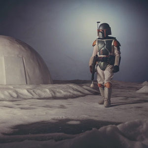 Boba Fett standing on an icy planet, The Mandalorian scene, blue tinted background.