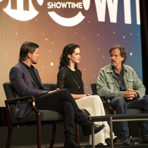 Josh Hartnett, Eva Green, and John Logan sitting on a stage. The backdrop features a large Showtime logo. They are discussing a new project.