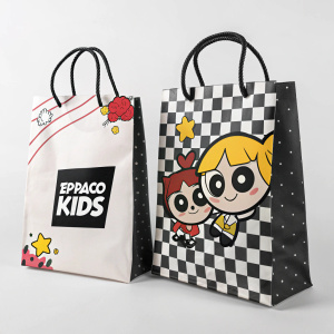 Promotional bags featuring Cartoon Network's Espaço Kids. Design includes black and white checkered pattern and bold logo. Simplistic flat illustration style.